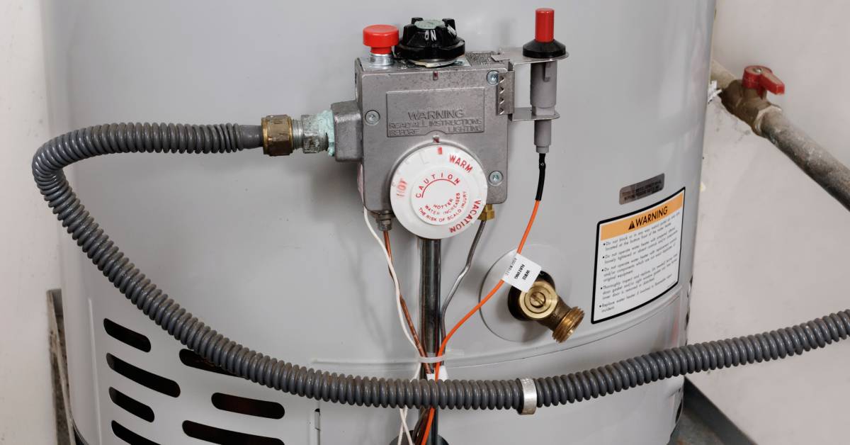 A hot water heater with adjustable temperature controls. The temperature dial is set to a moderate level.