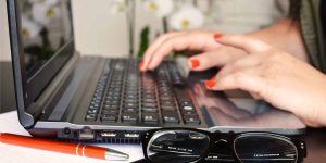 Woman working on a Microsoft Office laptop