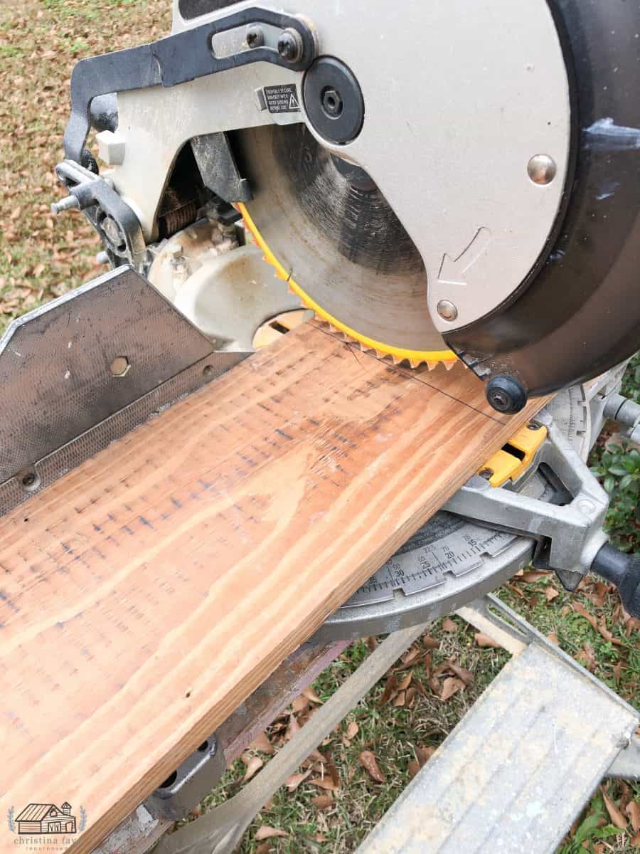 Cutting wood slats to length needed using chop saw. 