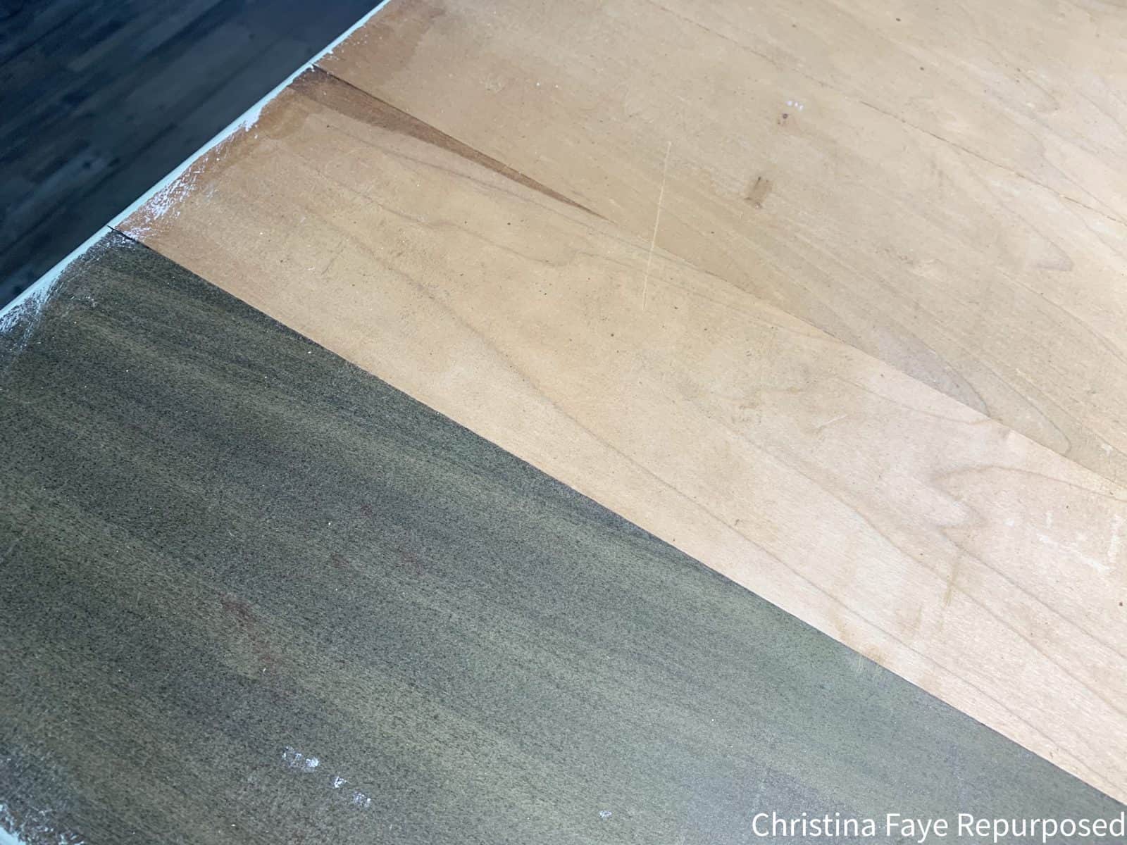 Top of vintage dresser showing green piece of wood