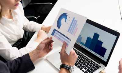 person holding white and blue box