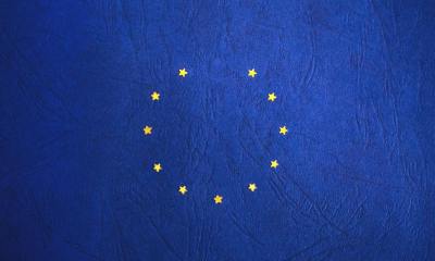 blue and yellow round star print textile