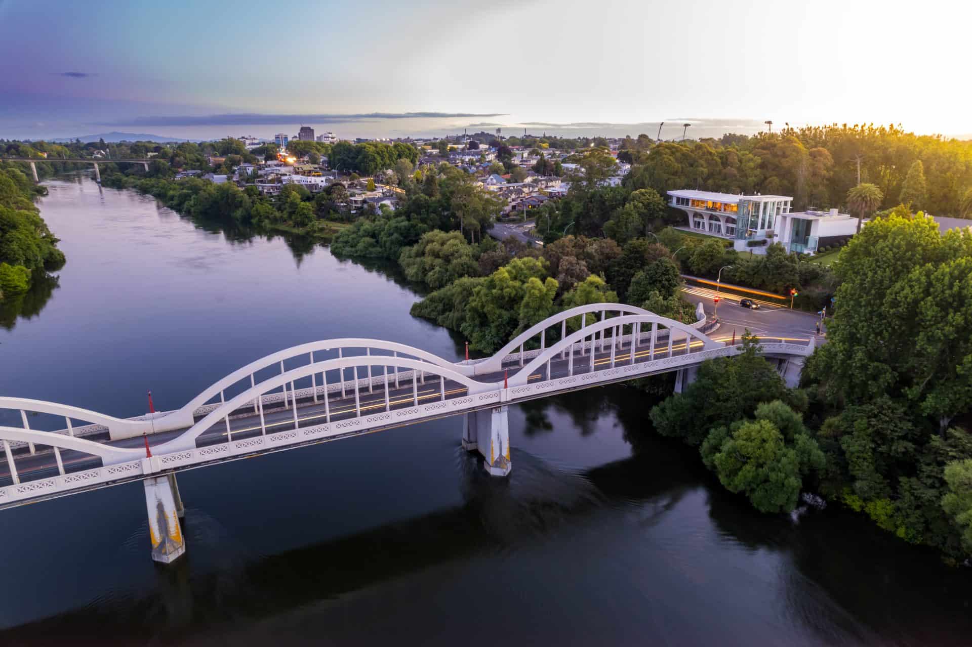 Aerial drone view at sunset, looking up the Waikato River towards the CBD, over the city of Hamilton (Kirikiriroa) in the Waikato region of New Zealand web-hosting