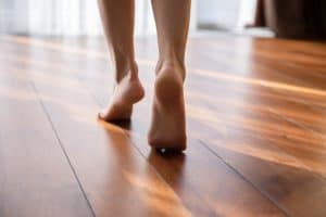The Advantages of Wood Floor Refinishing | Walking on wooden floors