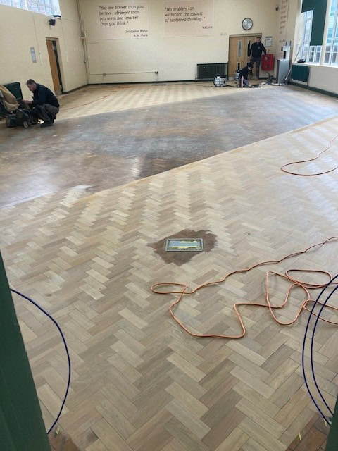 floor sanding sussex | school hall floor getting sanded