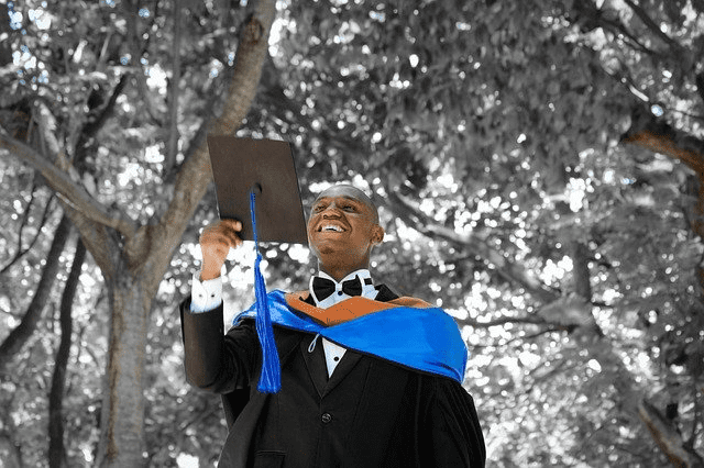 student looking at his motarboard