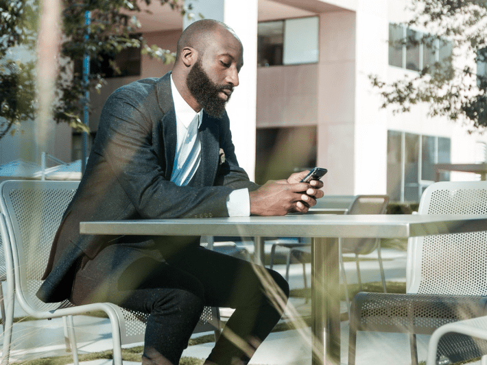 man_looking_at_phone