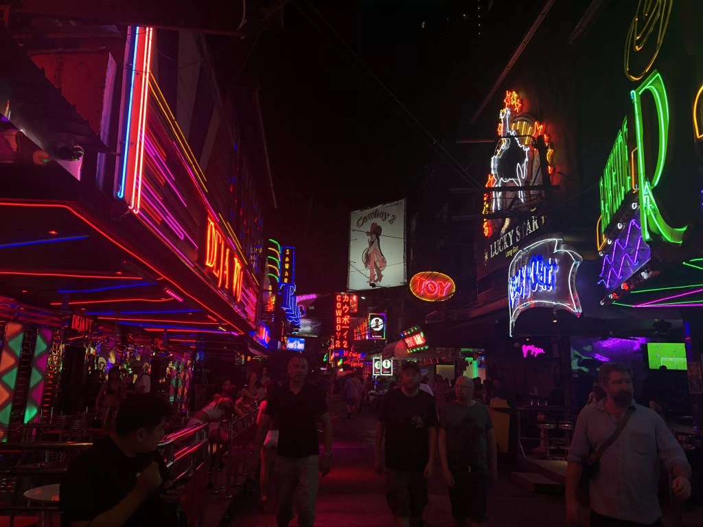 Picture of Soi Cowboy street at night — neon lights, tourists