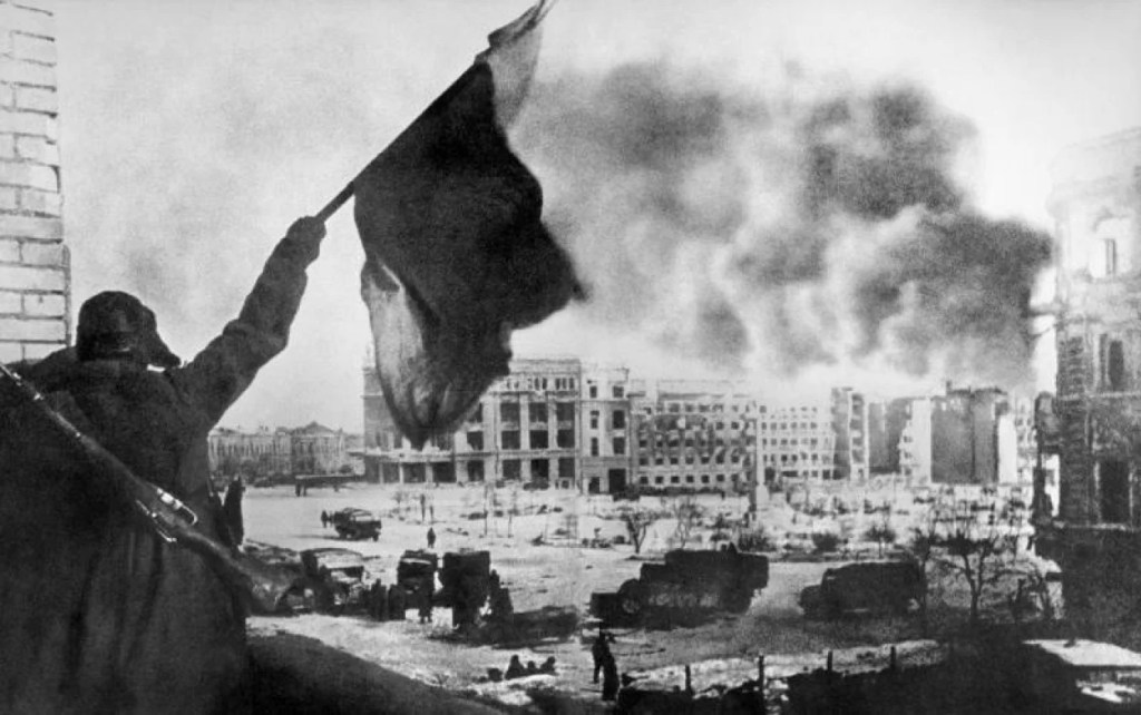 Picture of Red Army soldier in Stalingrad waving the red flag in 1943