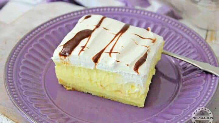 chocolate eclair cake on a purple plate with a dessert fork