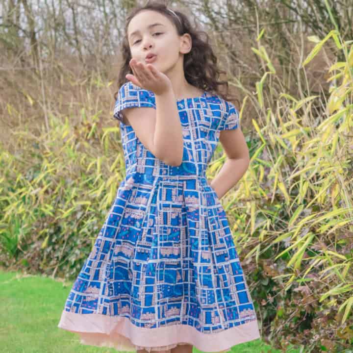 Girl wearing a house of frazer dress.