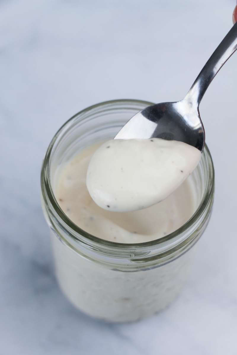 Mayonnaise and yogurt mixture in a jar.