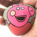Pepper pig painting on a rock.