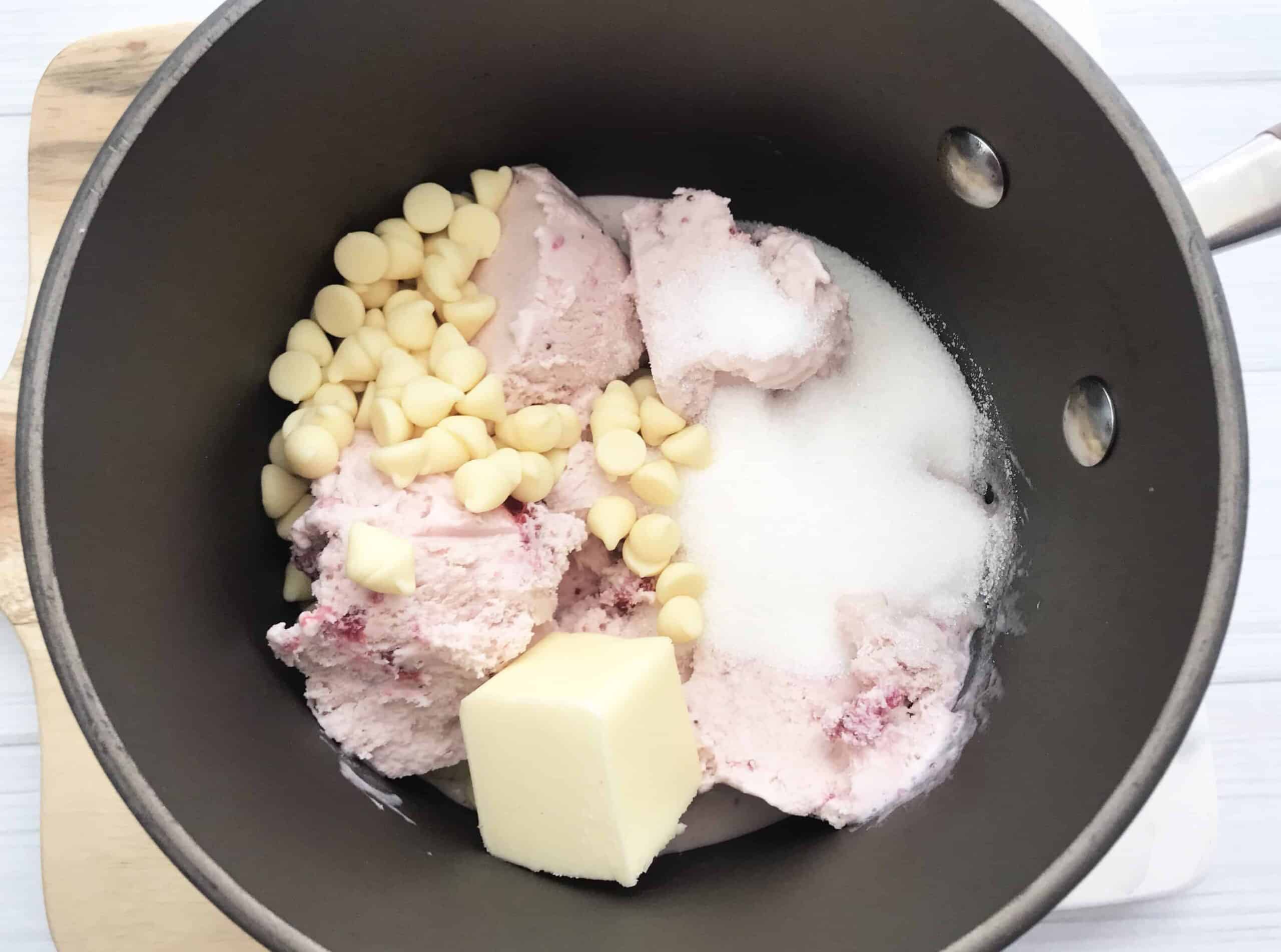 Ice cream, chocolate melts, butter, and granulated sugar in a skillet.