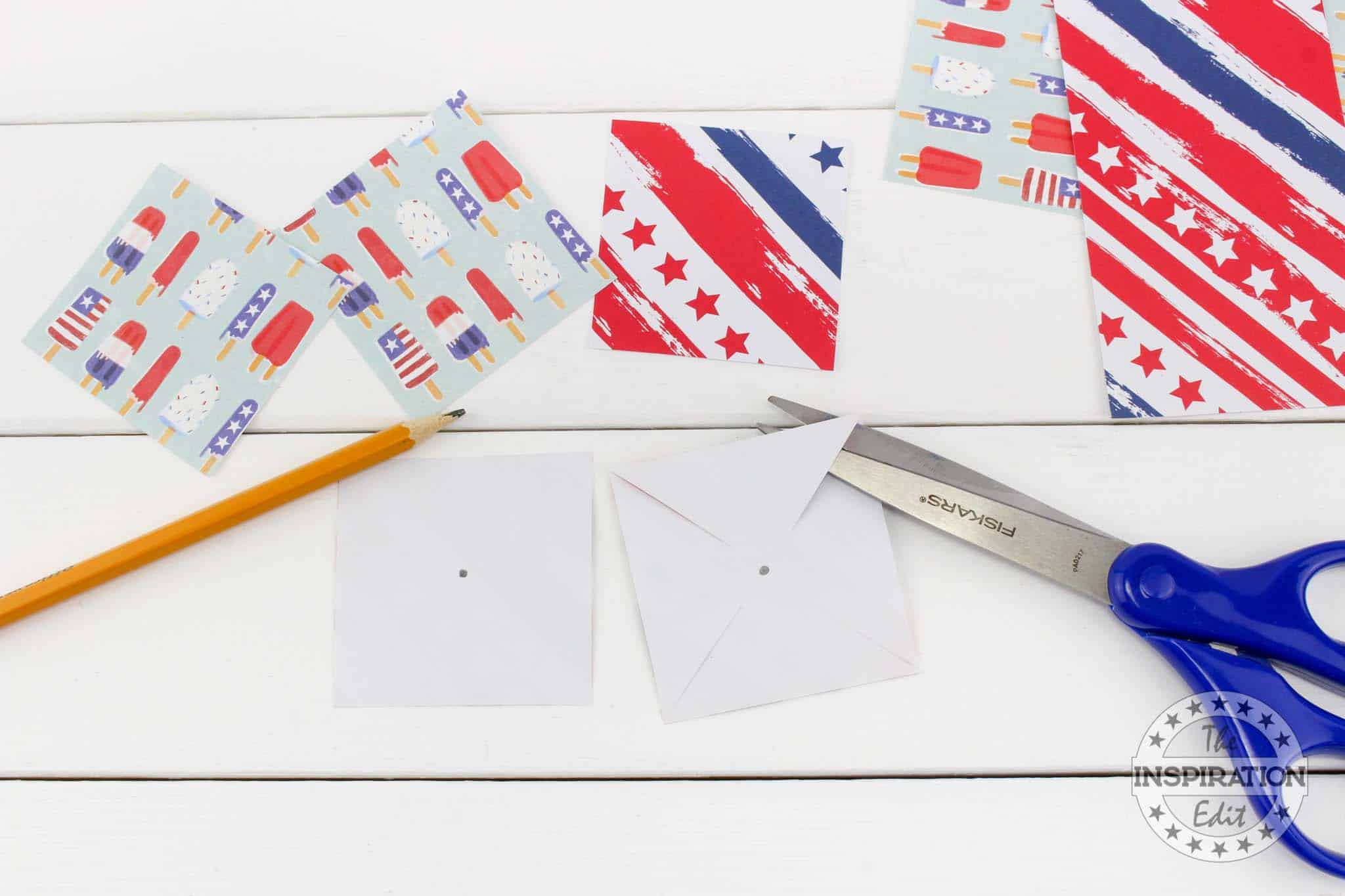 Paper squares and scissors.