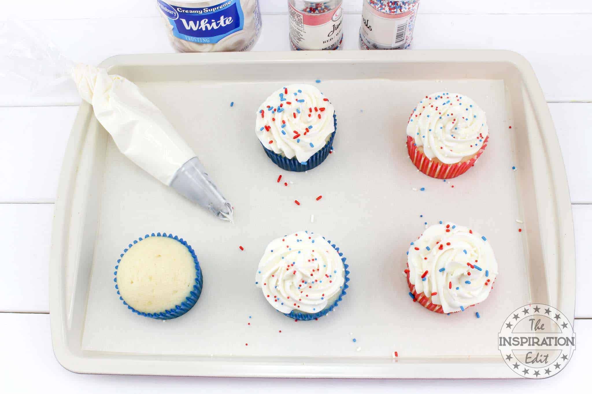 Decorating cupcakes with frosting.