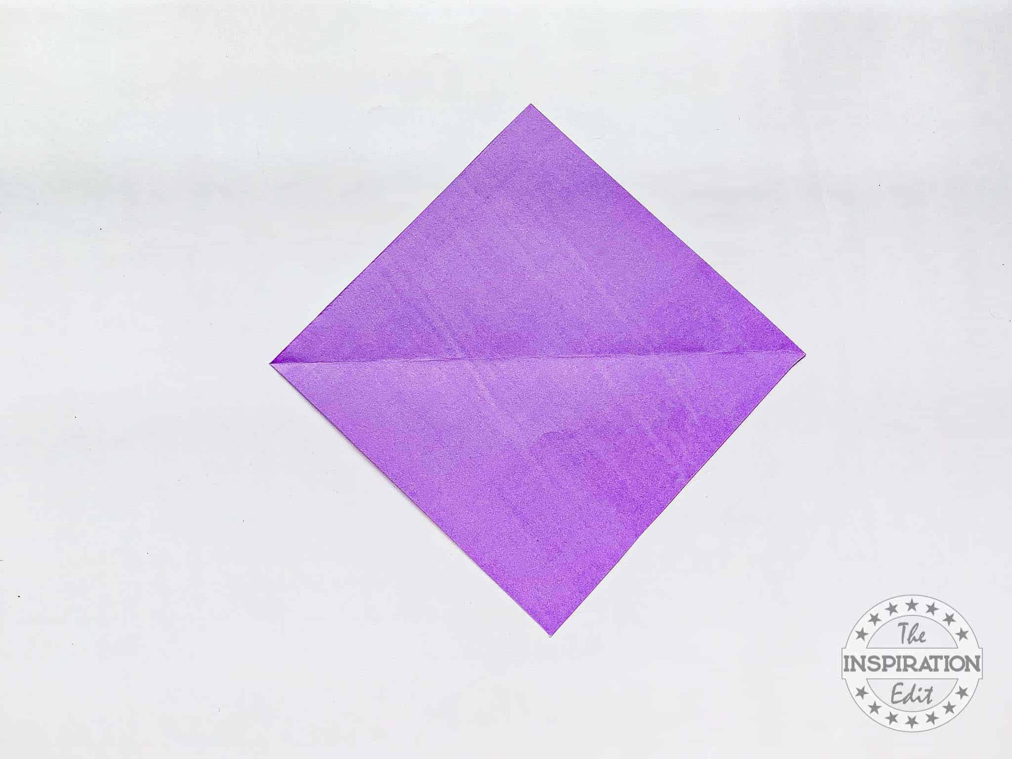 Square of purple craft paper.