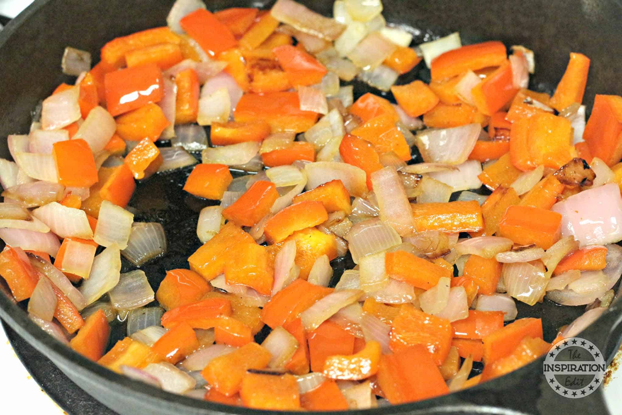 Sauteing vegetables in a skillet.