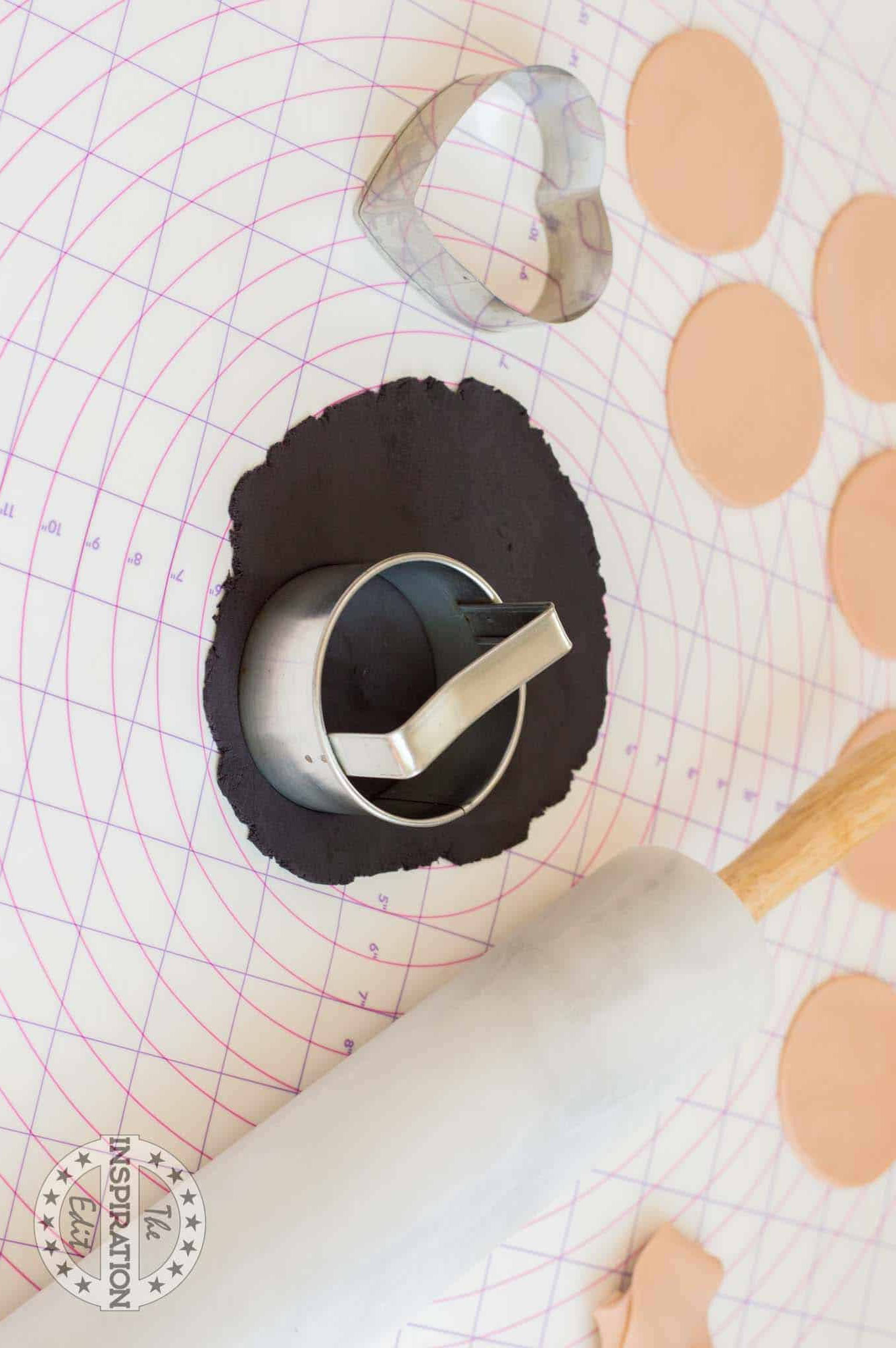 Cutting black fondant.