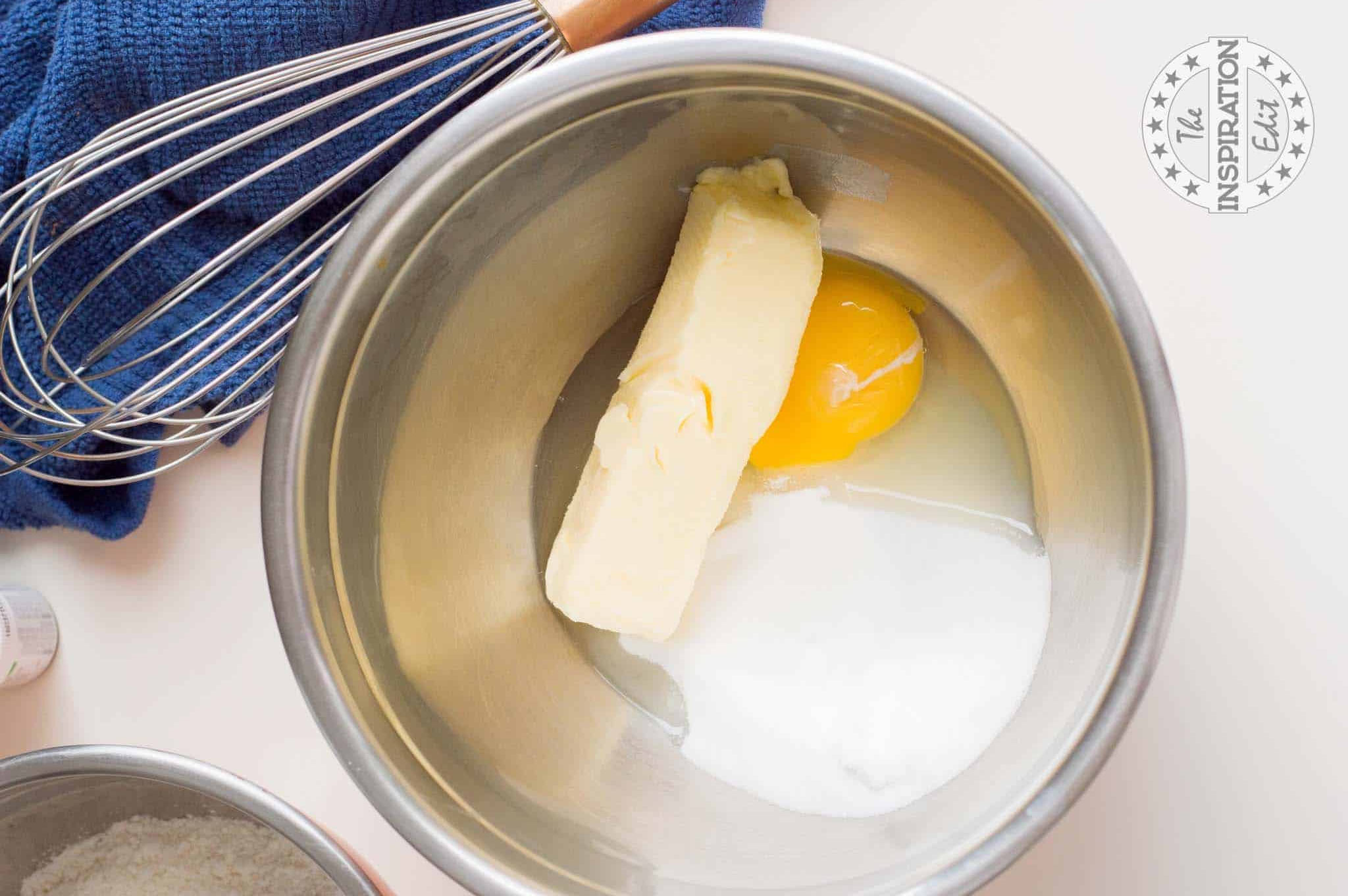 Butter, sugar, and egg in a bowl.