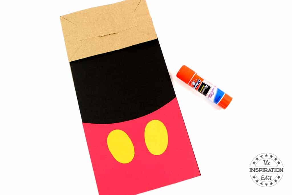 constructing a mickey mouse paper bag puppet