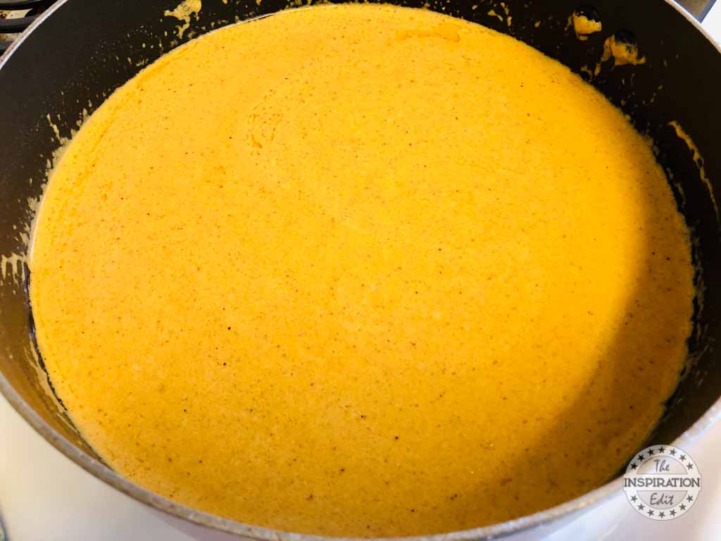 Pumpkin alfredo sauce in a skillet.