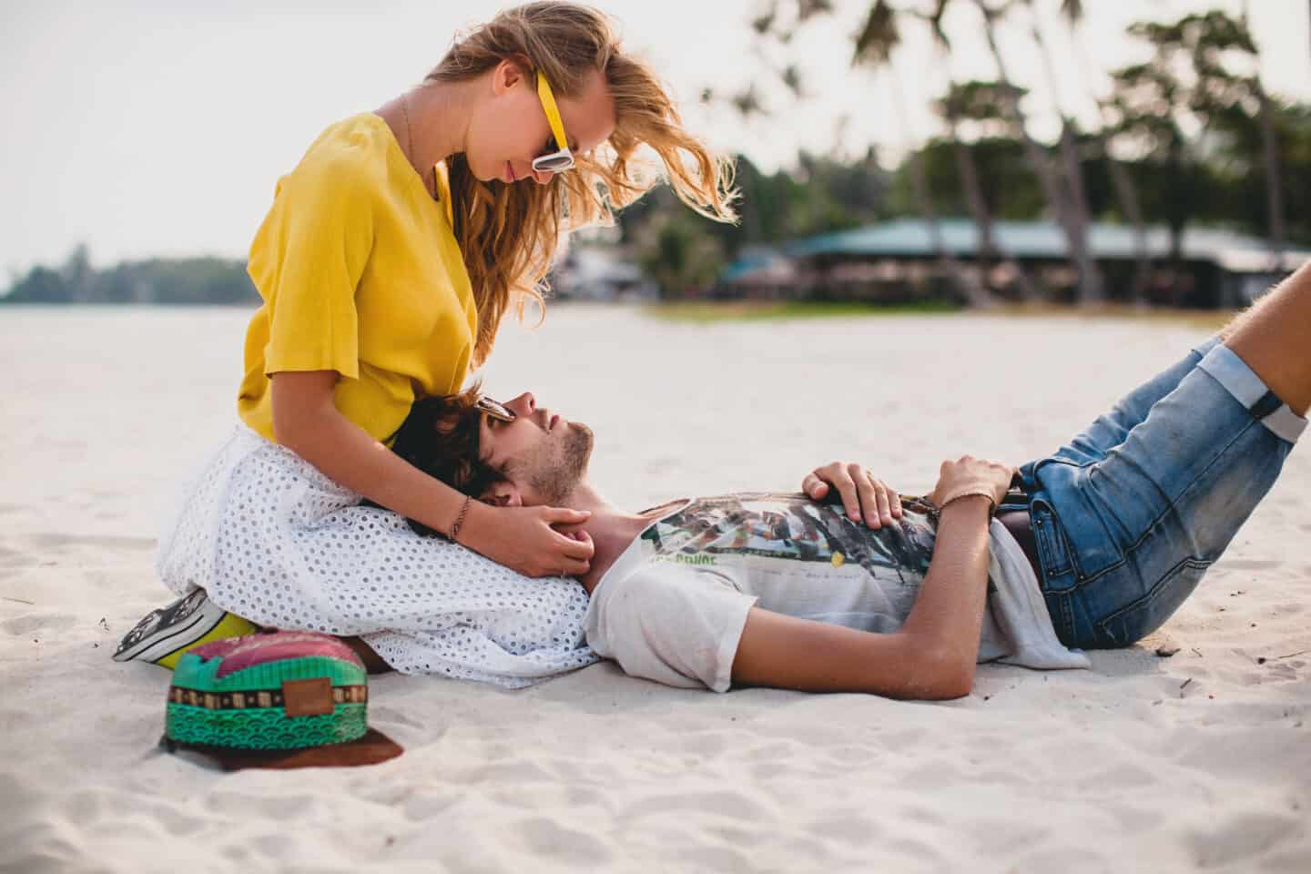 Young Stylish Hipster Couple in Love on Tropical Beach During Vacation Honeymoon, Embrace, Lovely, Romance, Tenderness, Colorful Style Sunglasses.