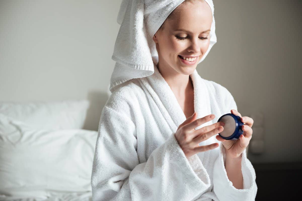 Skincare Products | Beautiful Woman Apply Skin Care Lotion.