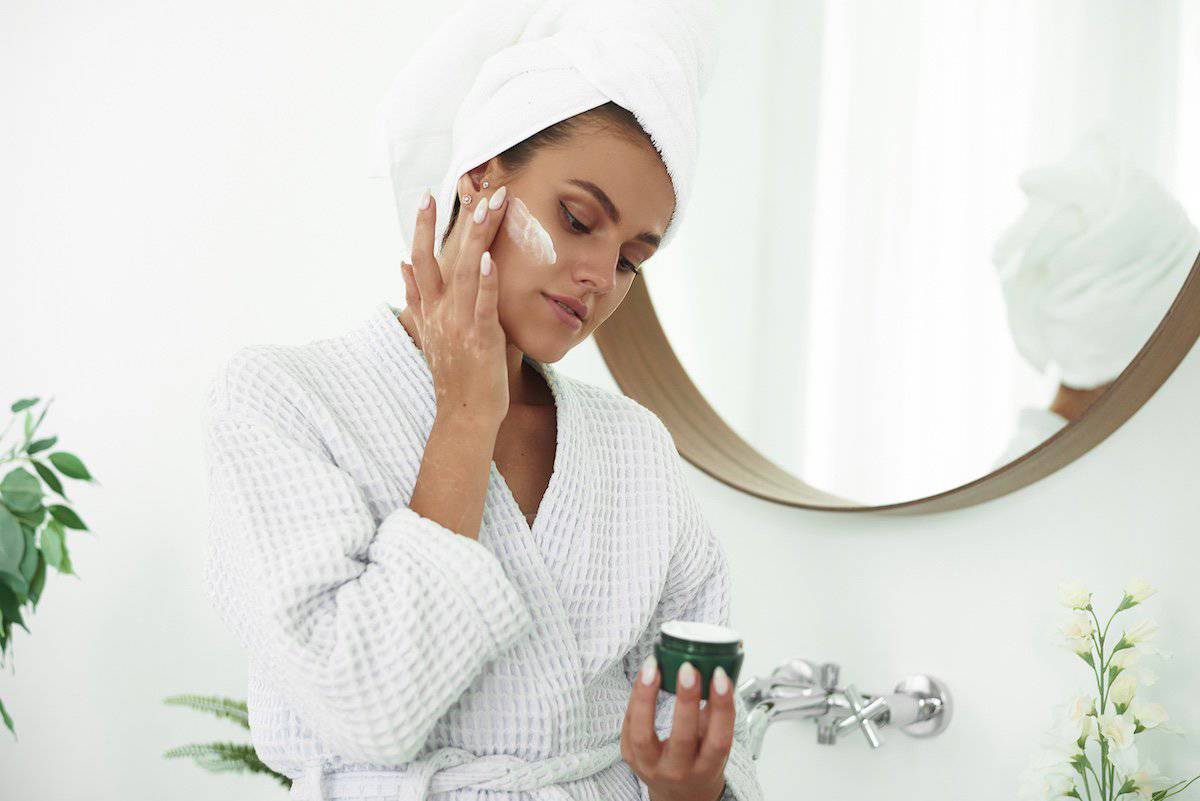 Skincare Products | Beautiful Woman Apply Skin Care Lotion.