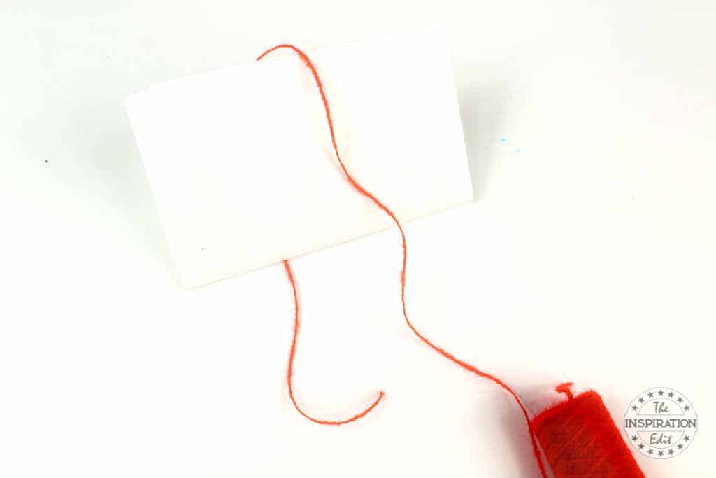 Making a Bookmark Tassel with Red Wool.