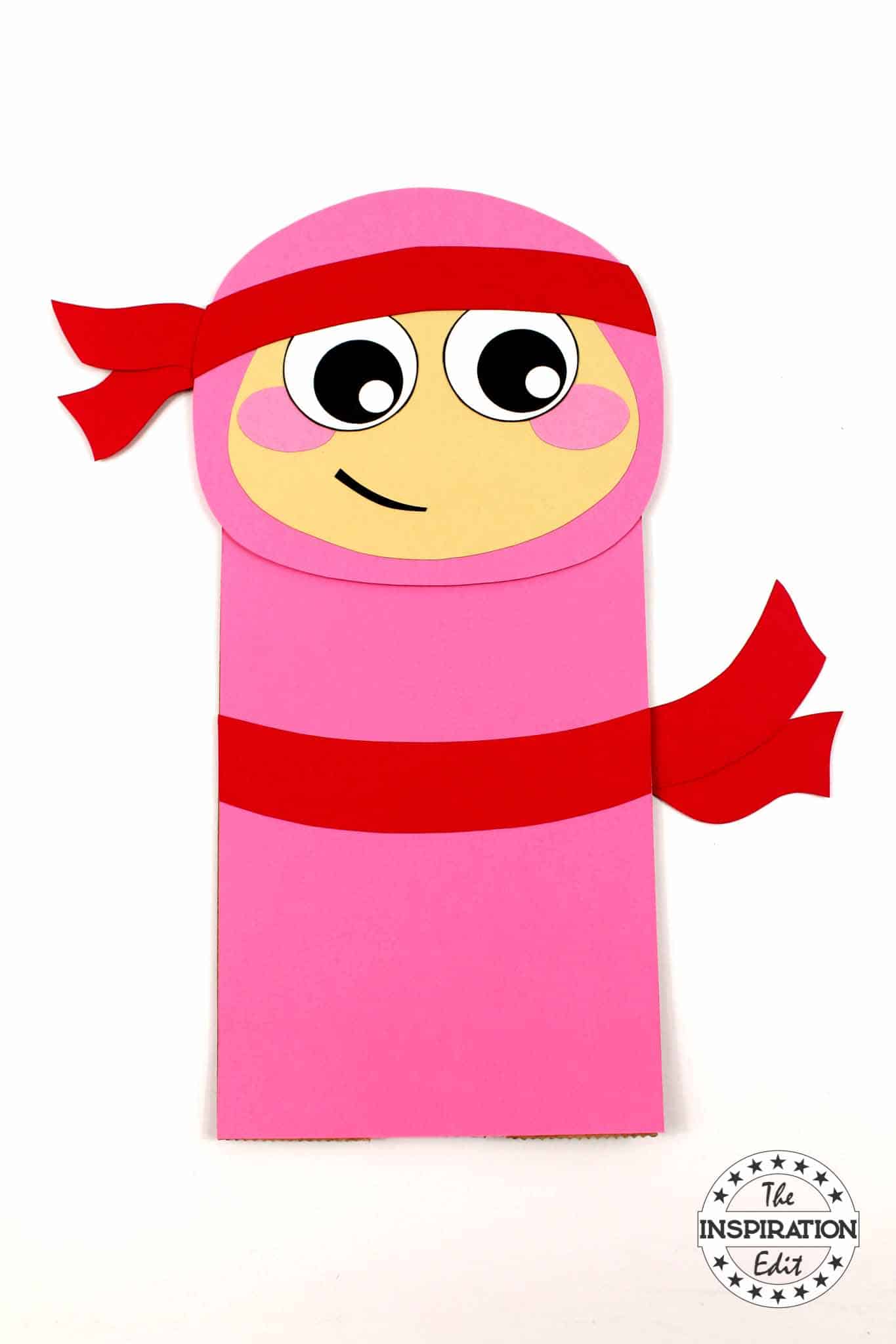 pink and red ninja made from a paper bag 