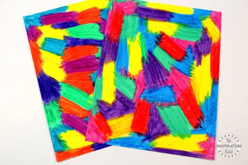 Coloring the White Paper with Crayons.