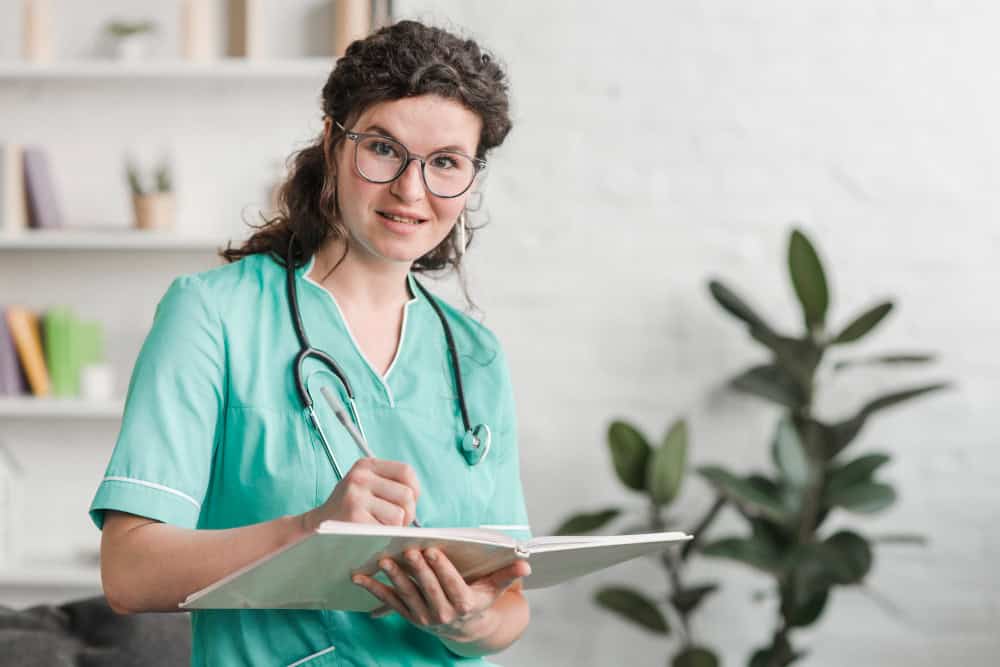 Nurse in Uniform Holding Pen and Workbook.