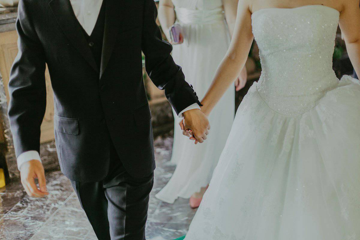 Components of a Great Wedding | Man and woman holding hands after getting married.