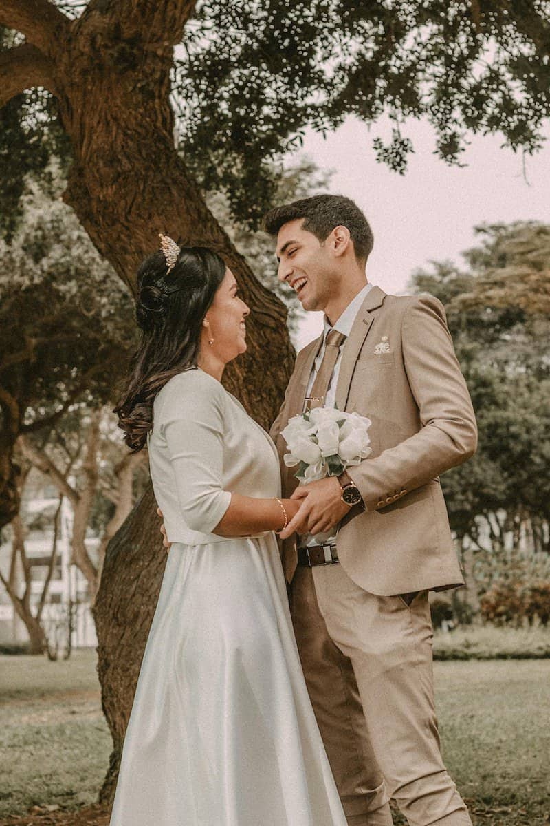 Components of a Great Wedding | Man and woman holding each other after getting married.