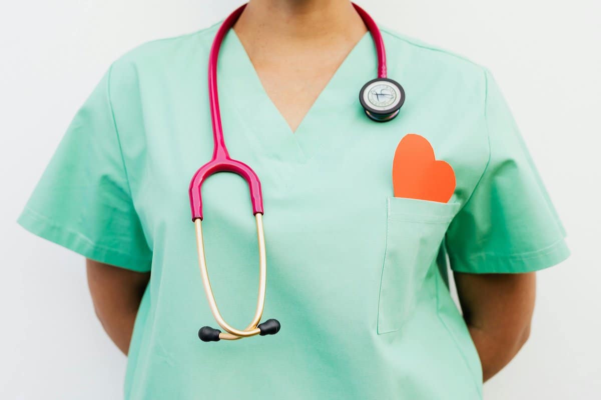 Build A Career In Nursing | A Nurse in uniform with a stethoscope.