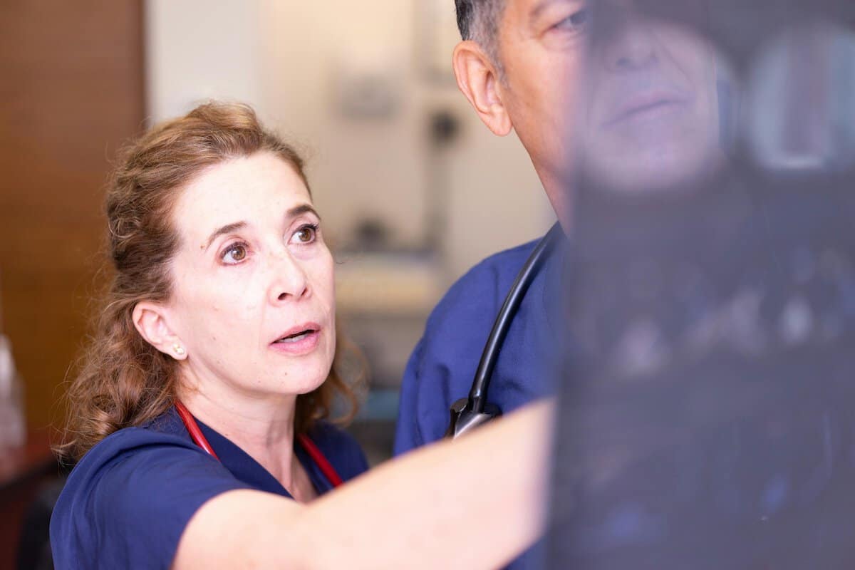 Build A Career In Nursing | Two nurses consulting over an x-ray.