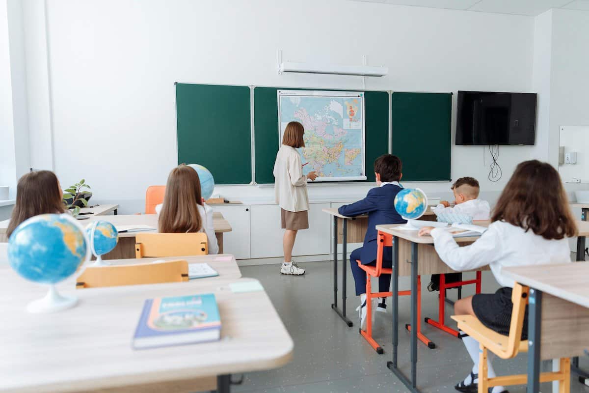 Exploring the Unique Role of Catholic Schools |  Children being taught in a school.