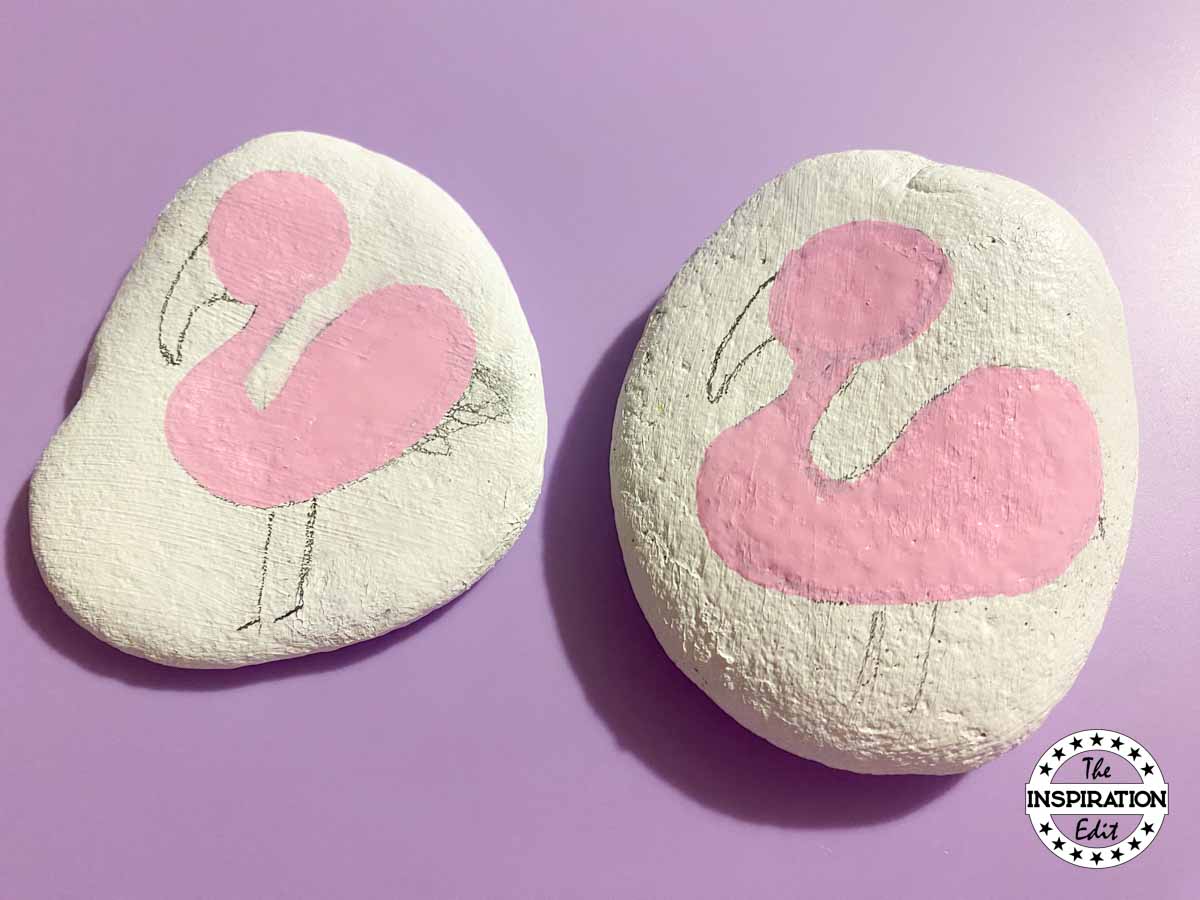 painting flamingo on a stone. 