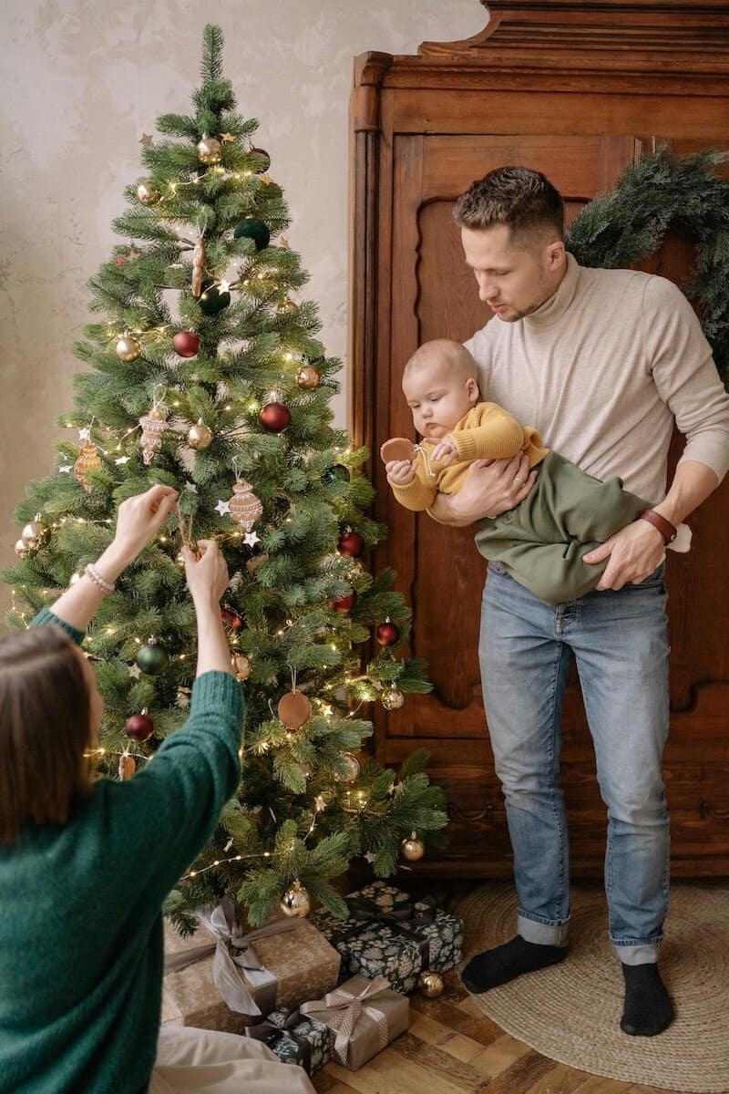 Navigating Holiday and Special Occasion | A Family  putting up the Christmas Tree.