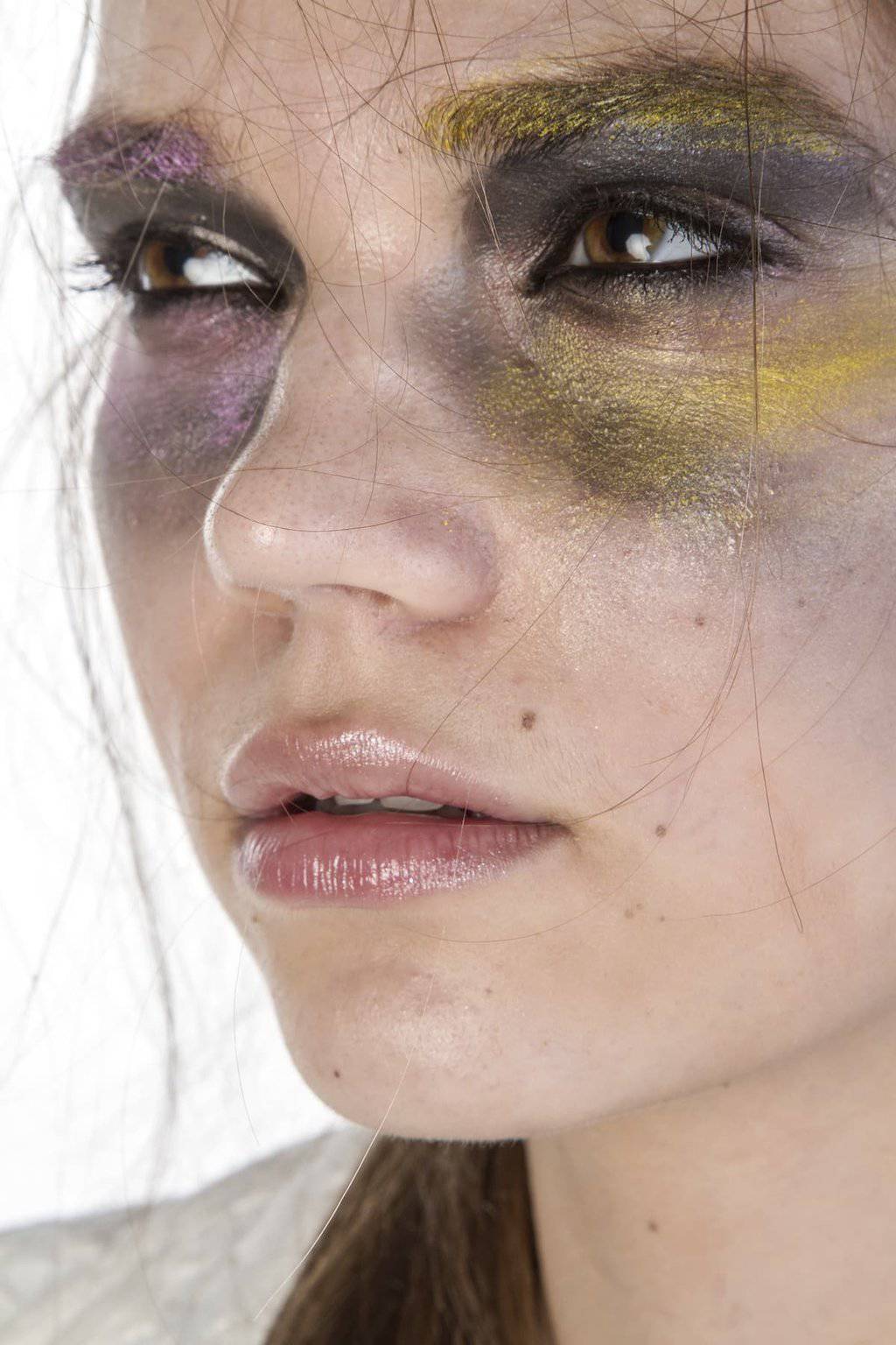 Legal Strategies Against Domestic Abuse | A woman covered in fake bruises.