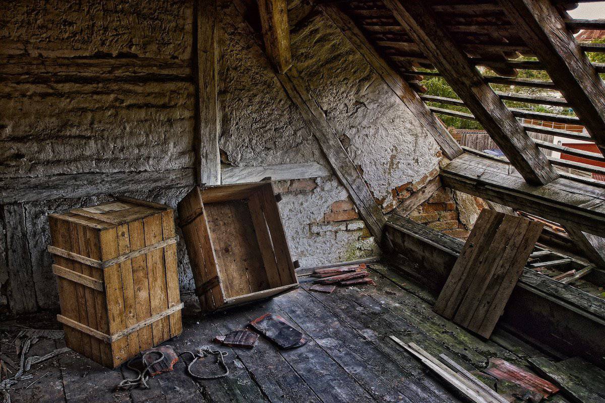 Understanding Roof Replacement Costs | A Damaged roof in bad need of a major repair.