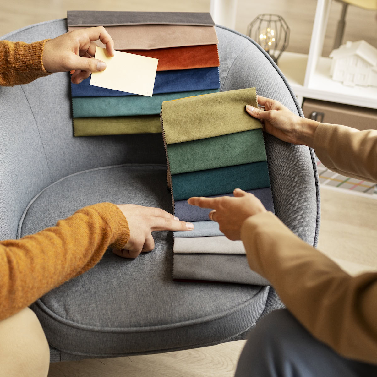 How to Find Designer Furniture for Less | A designer showing color samples for furniture.