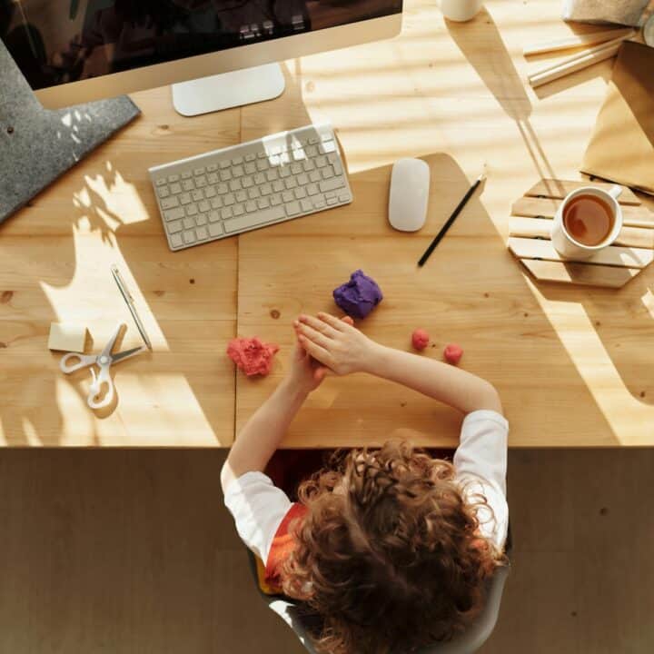 Home office desk tops that work | A woman sat her home office desk.