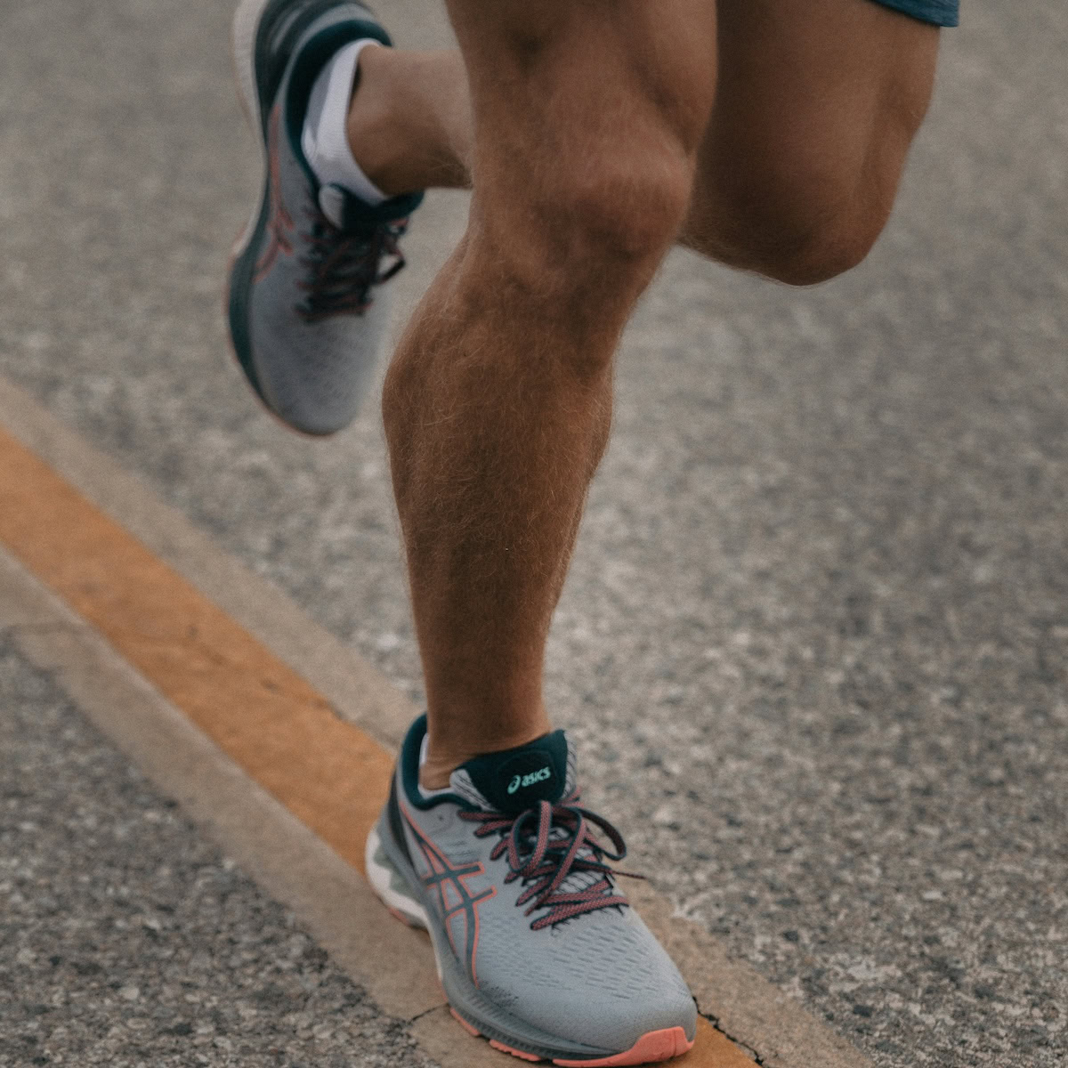 Perfect Athletic Shoes for Your Activity | man on a run with his new trainers/shoes.