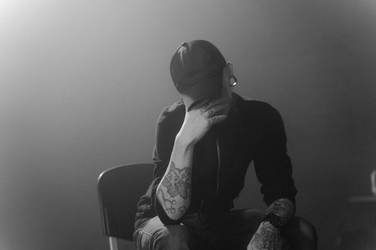 Practical tips for substance use recovery | An addict having problems with his head in hands.