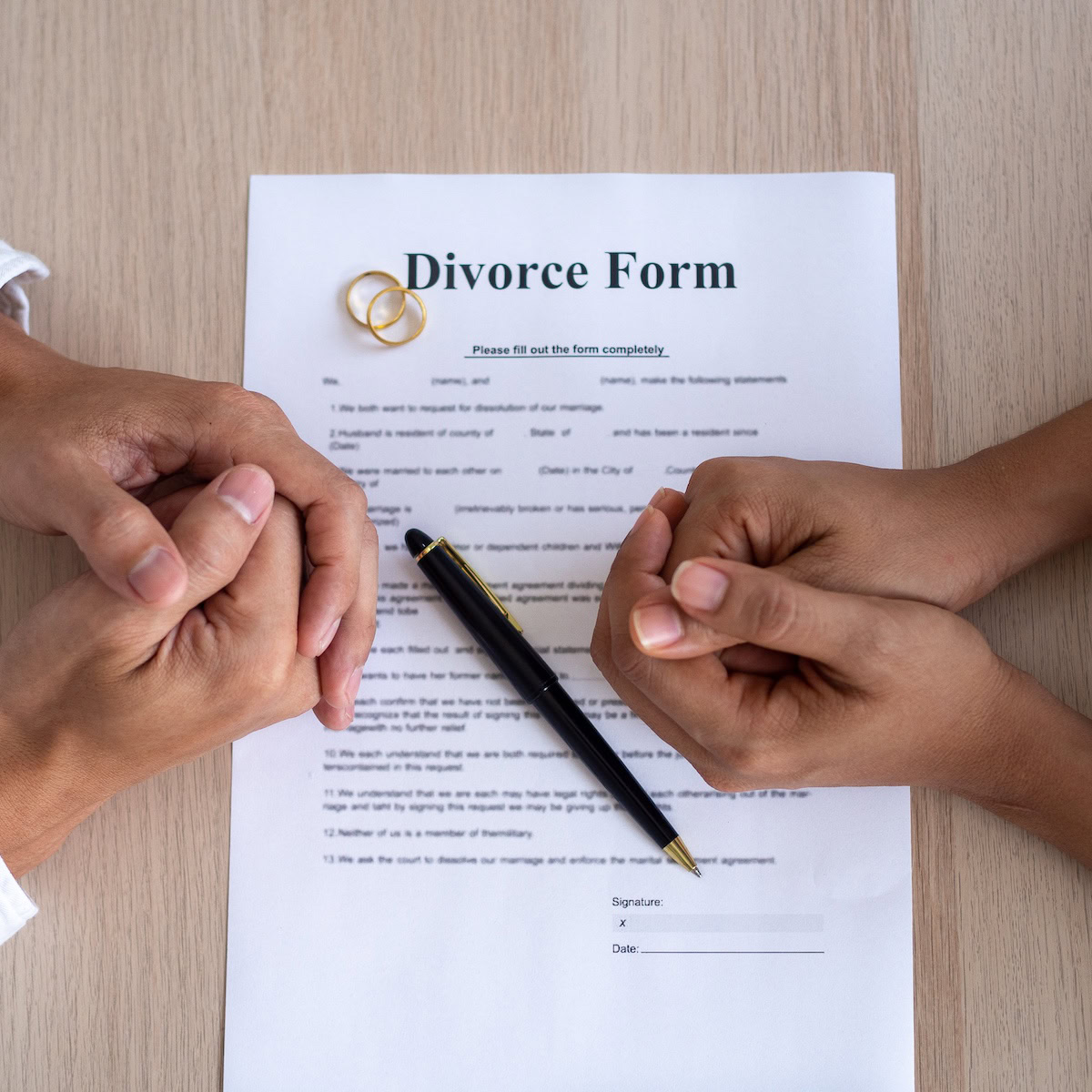 Property Division Lawyer in Divorce | A Man and woman finalising their divorce.
