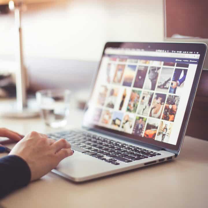 SVG image resources in 2025 | A woman looking for stock images on her computer.