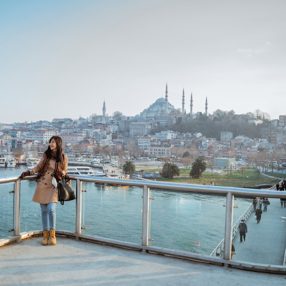 Travel Turkey on a budget | asian woman on a bridge of beautiful city of Istanbul.