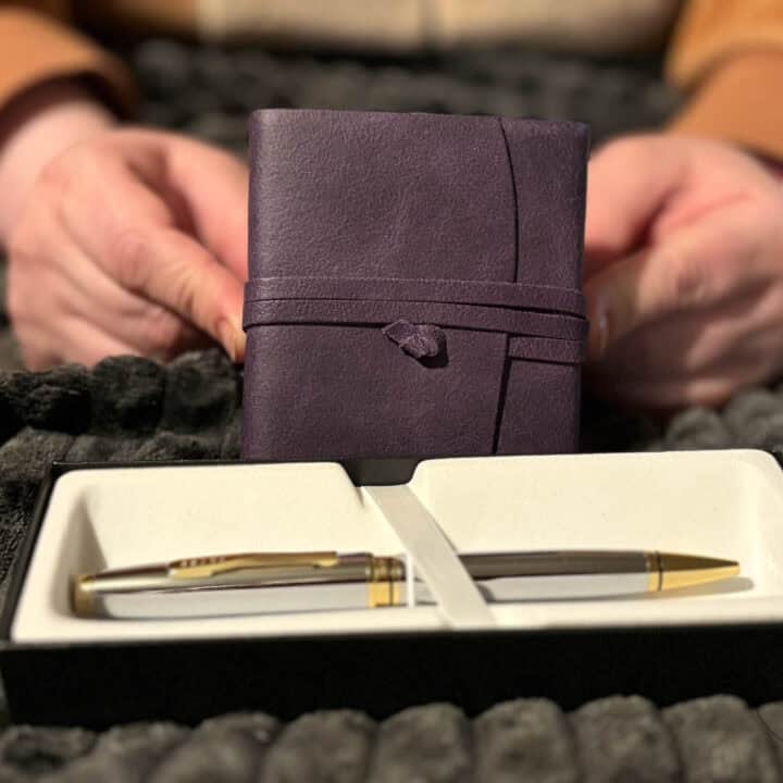 purple journal and cross pen.